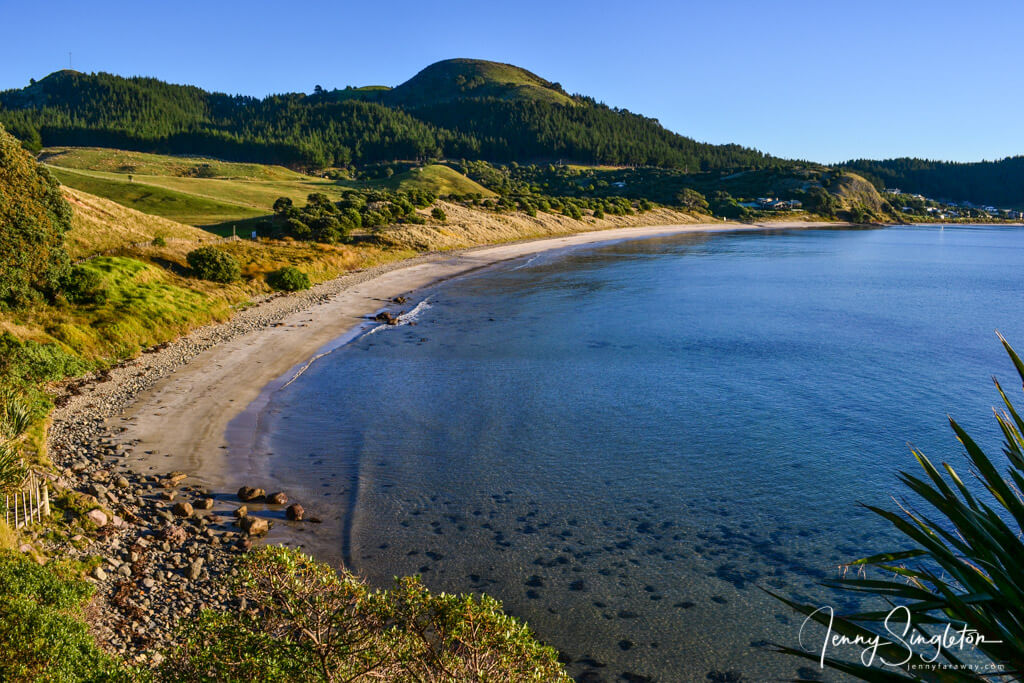 The view of the beach, bay, and surrounding hills from Opito Point Pa Site